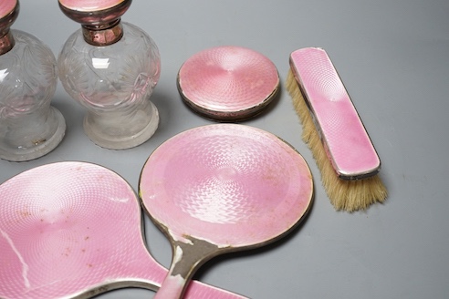 A George silver and enamel mounted glass part dressing table set, by Henry Clifford Davis and a similar American hand mirror.